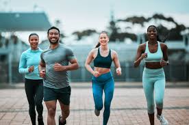 Sculpting Sleek Arms: The Essential Role of Cardio in Toning Without Bulking Up 3 image of people running to incorporate cardio Kent exercise into their life to help tone arms and body.