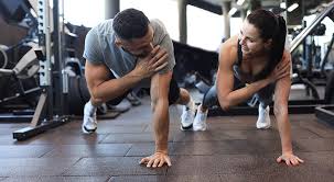 Sculpting Sleek Arms: The Essential Role of Cardio in Toning Without Bulking Up 1 Image of man and woman doing Cardio Kent to tone their arms.